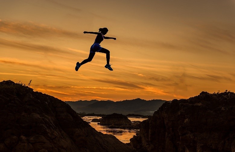 Girl jumping during sunset (Image by Sasin Tipchai from Pixabay.)